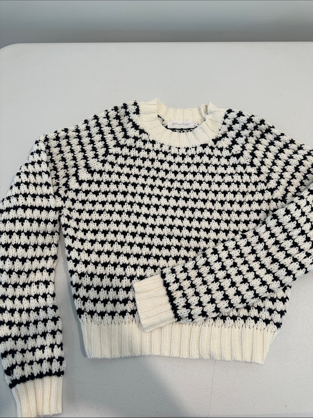 All in Favor Black and Cream Houndstooth-Style Crewneck Sweater